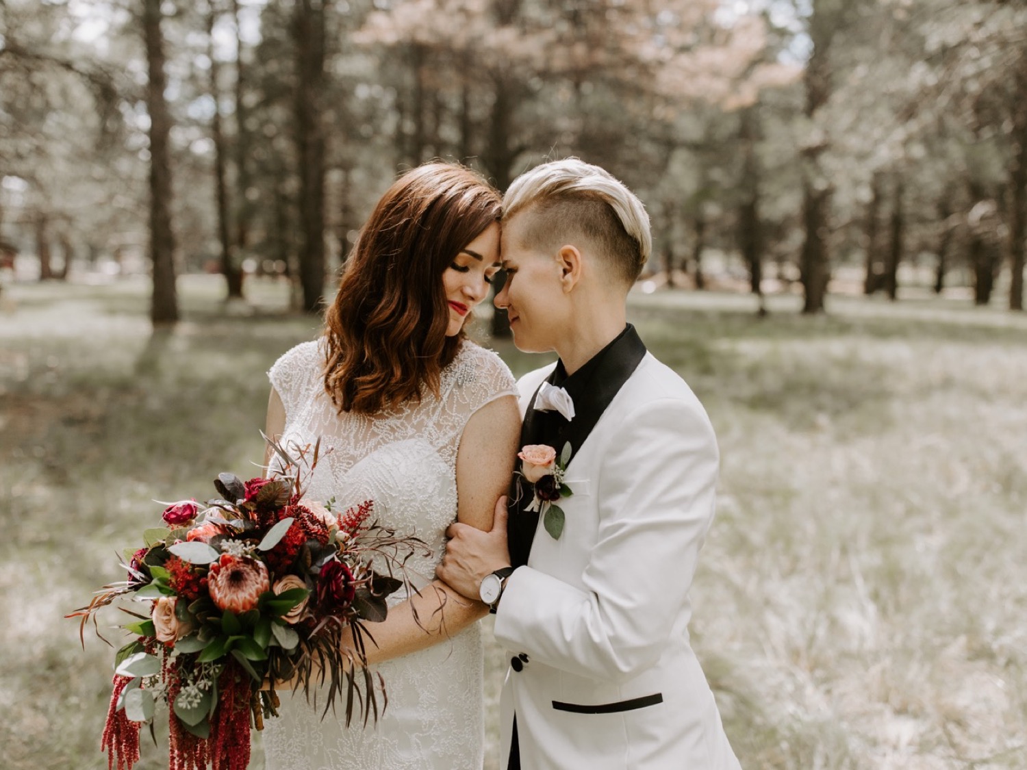 Brides snuggling in the woods of Flagstaff