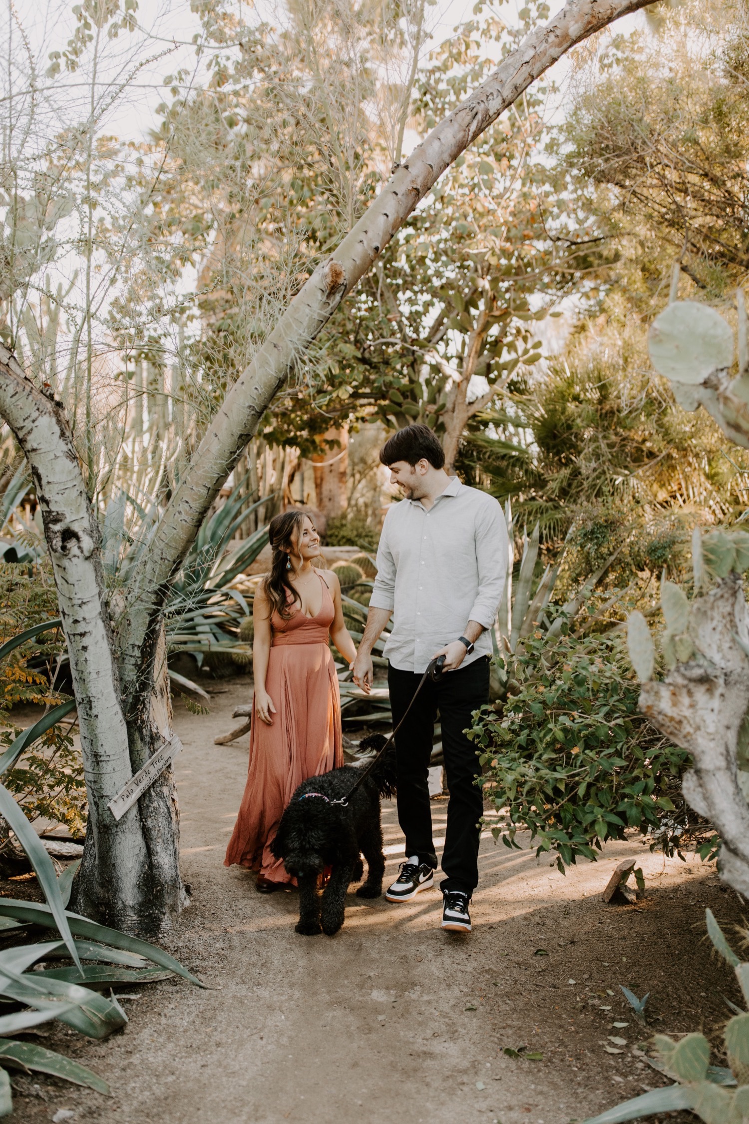Engagement photos at the Moorten Botanical Garden with their dog