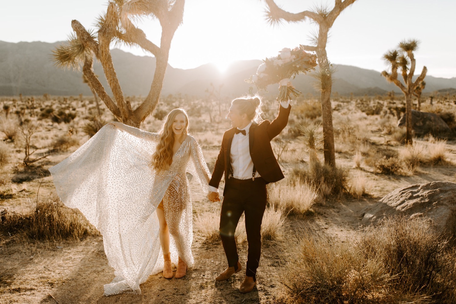 The bride and groom celebrating at their Joshua Tree elopement