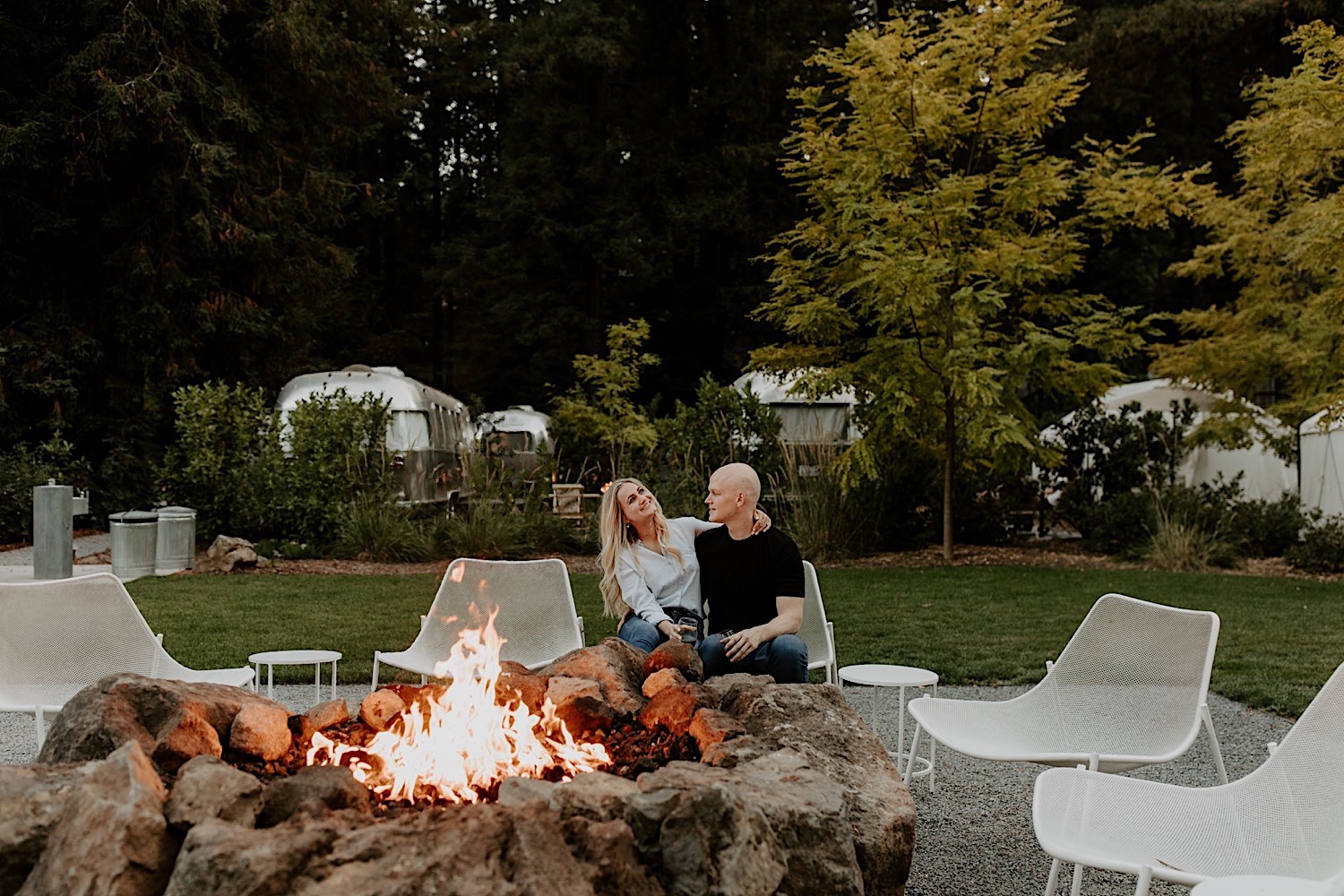 Cozy couples session next to fire