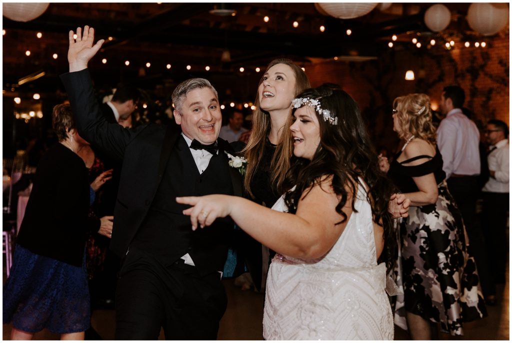 Bride and groom dancing together during wedding reception