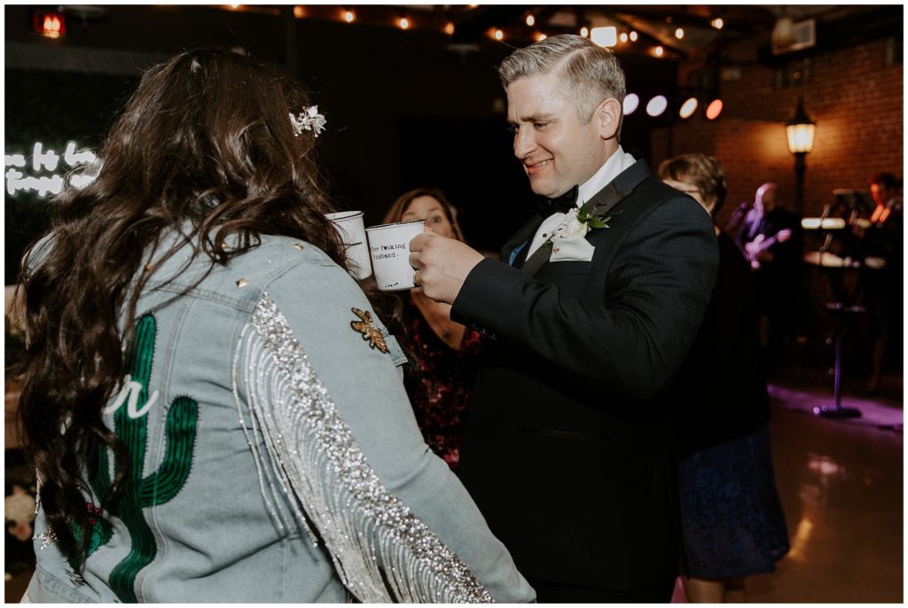 Bride and groom sip drinks from Bubbles and Brews during wedding reception