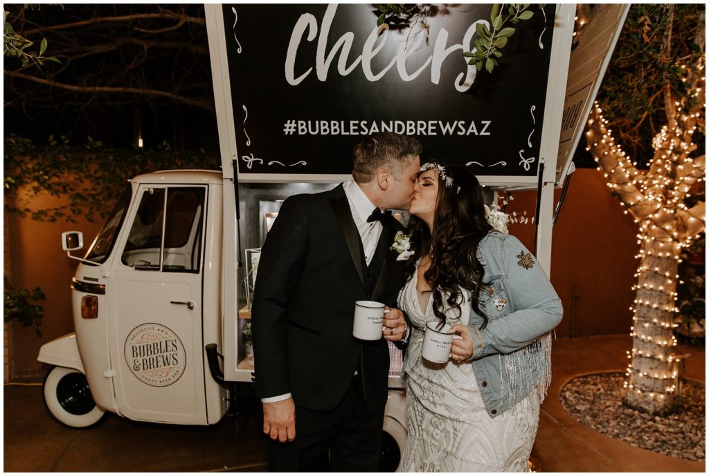 Bride and groom sip drinks from Bubbles and Brews during wedding reception