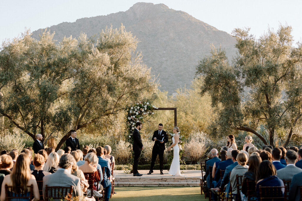bride and groom stand at the altar during their ceremony at their Scottsdale wedding venue