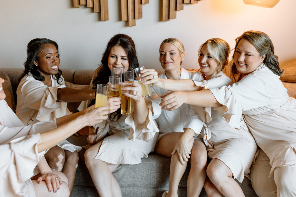 bridesmaids share a cheers with the bride at her Scottsdale wedding venue